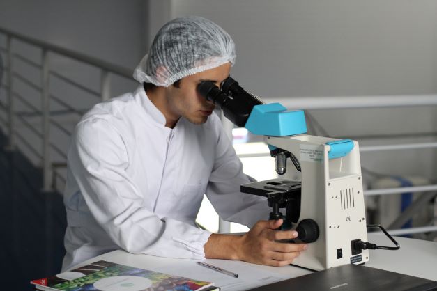 Scientist with microscope