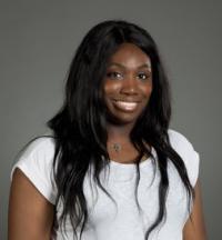 Photo of Dr. Frances Adelaja in a white shirt