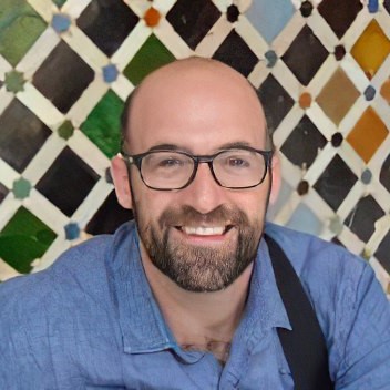 Photo of Dr. Tyler Albert in a blue shirt