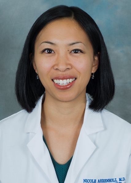Nicole Ahrenholz headshot in lab coat