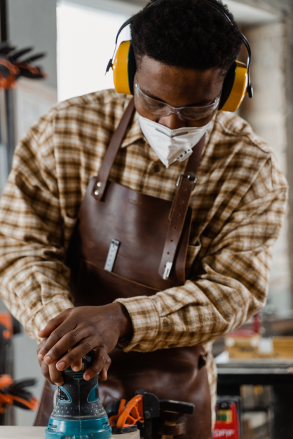 Man with goggles, ear protectors and mask